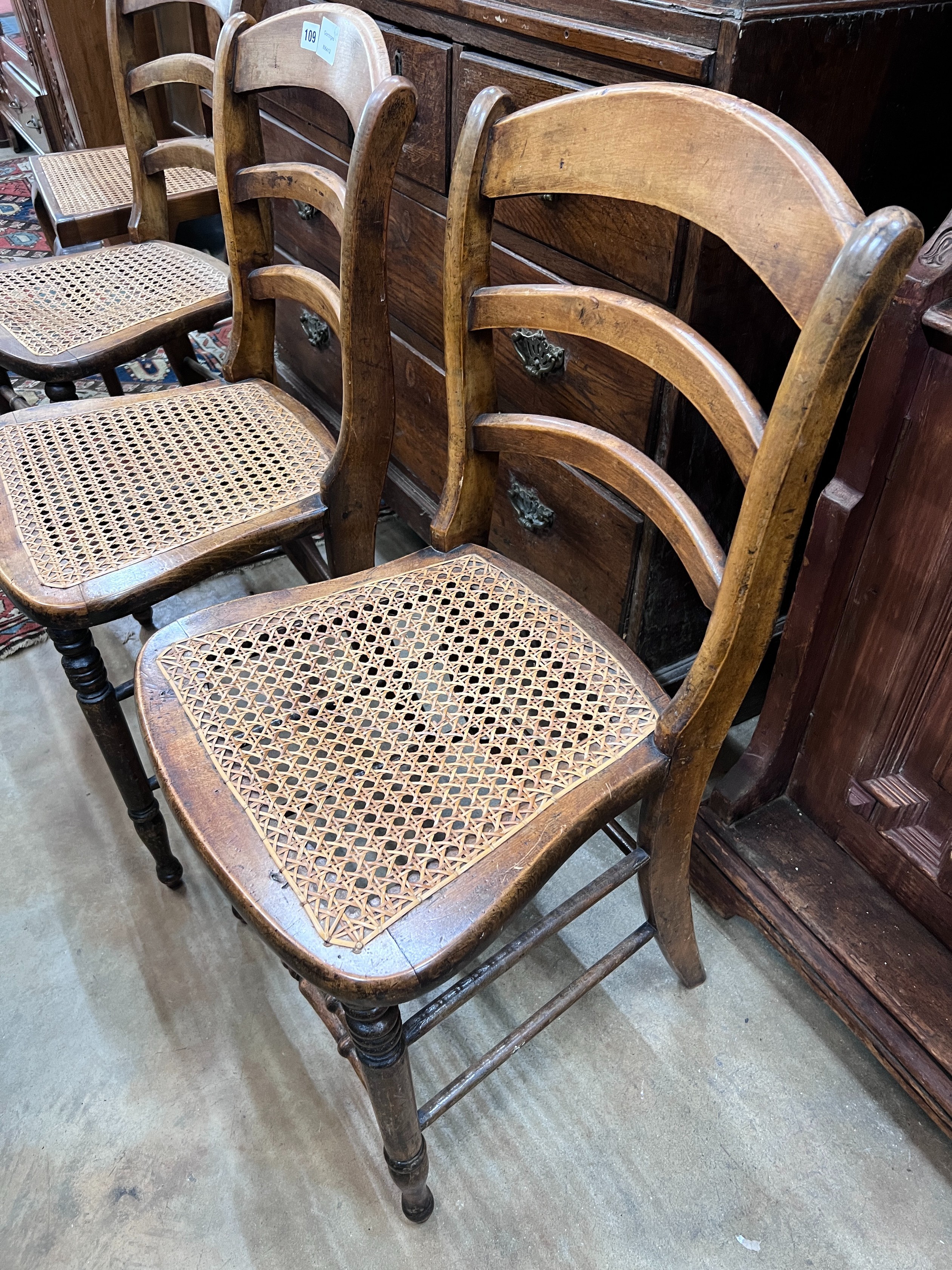 Three Victorian caned beech ladder back dining chairs *Please note the sale commences at 9am.